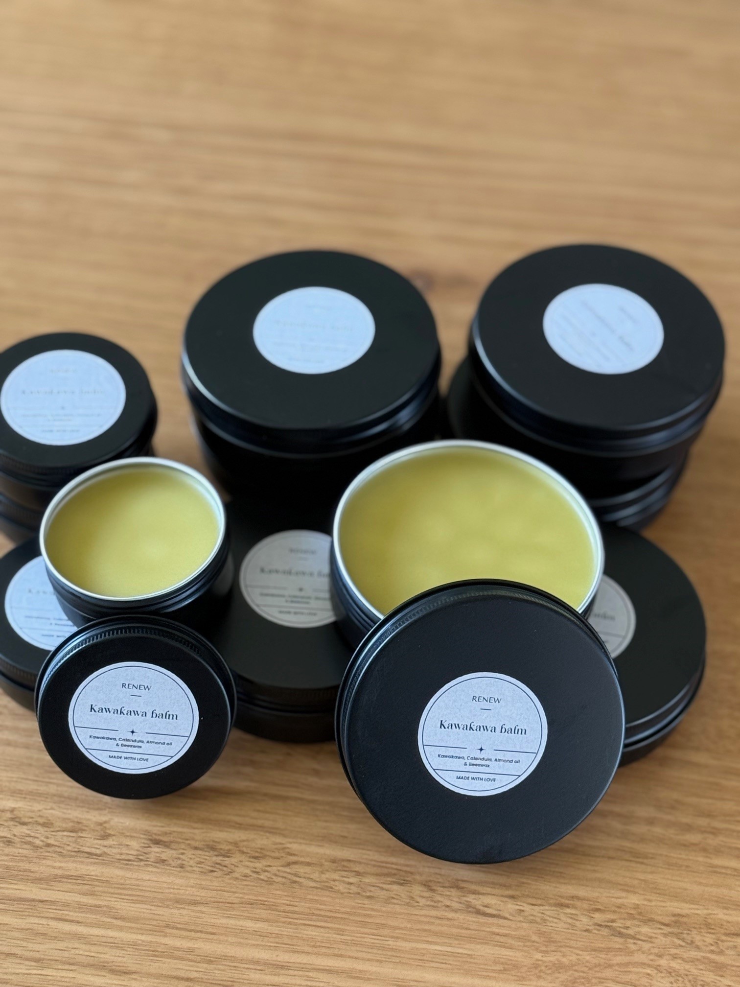 Tins of the studio's own kawakawa balm